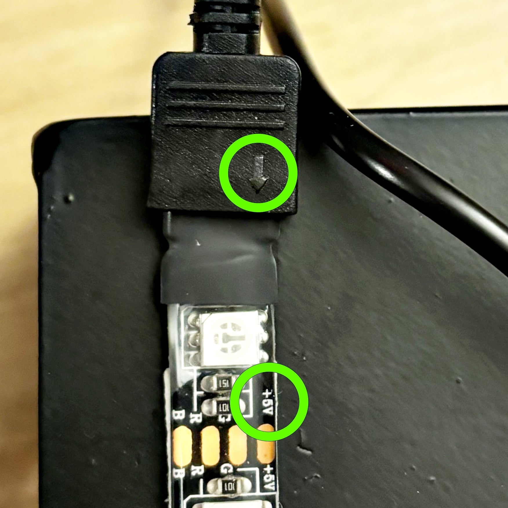 close up of how to plug in your connector cord to your light strip